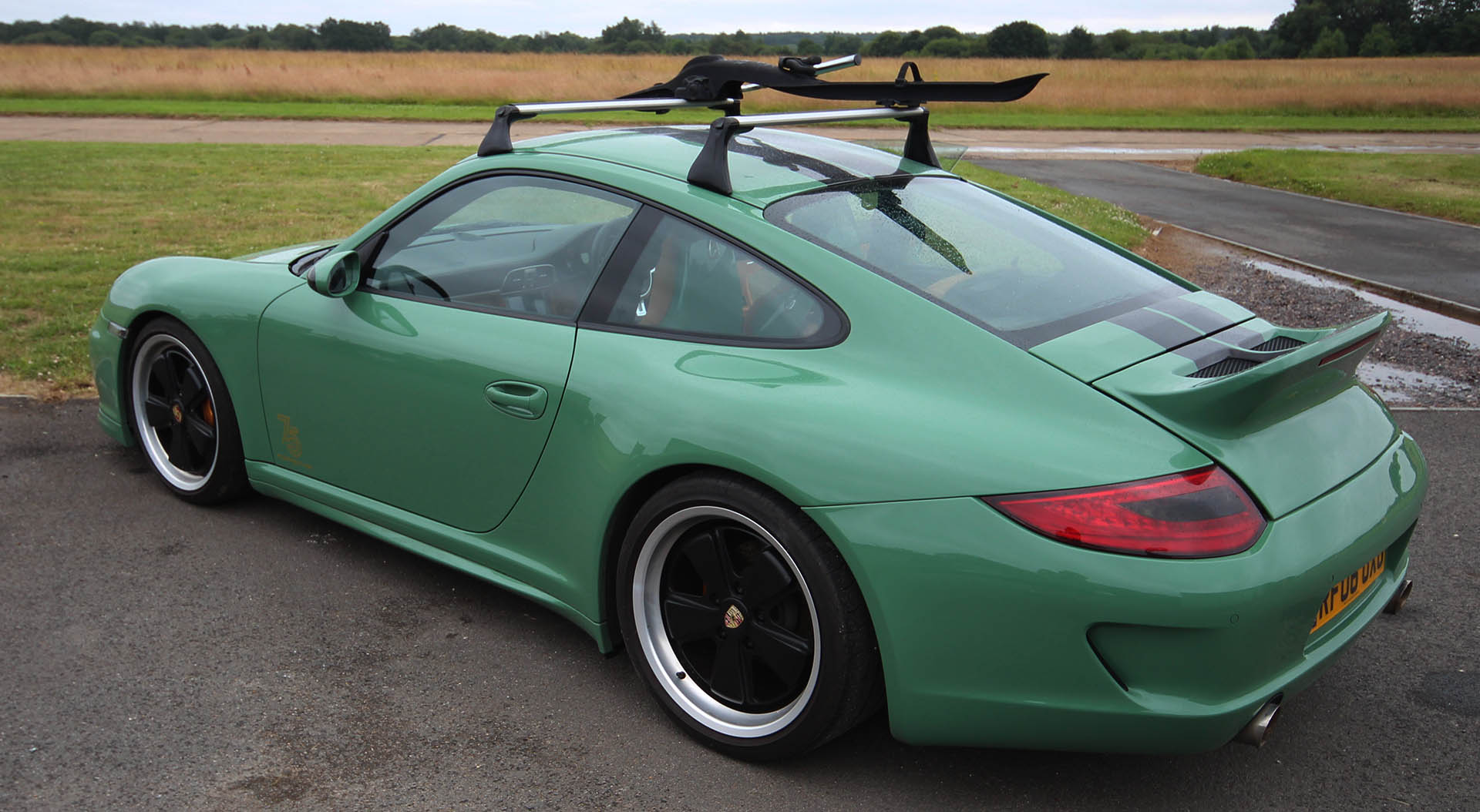 Porsche 911 997 Sports Classic conversion in Auratium green colour by Designls ltd featuring rear bumper with duck lid spoiler and custom exhaust tips