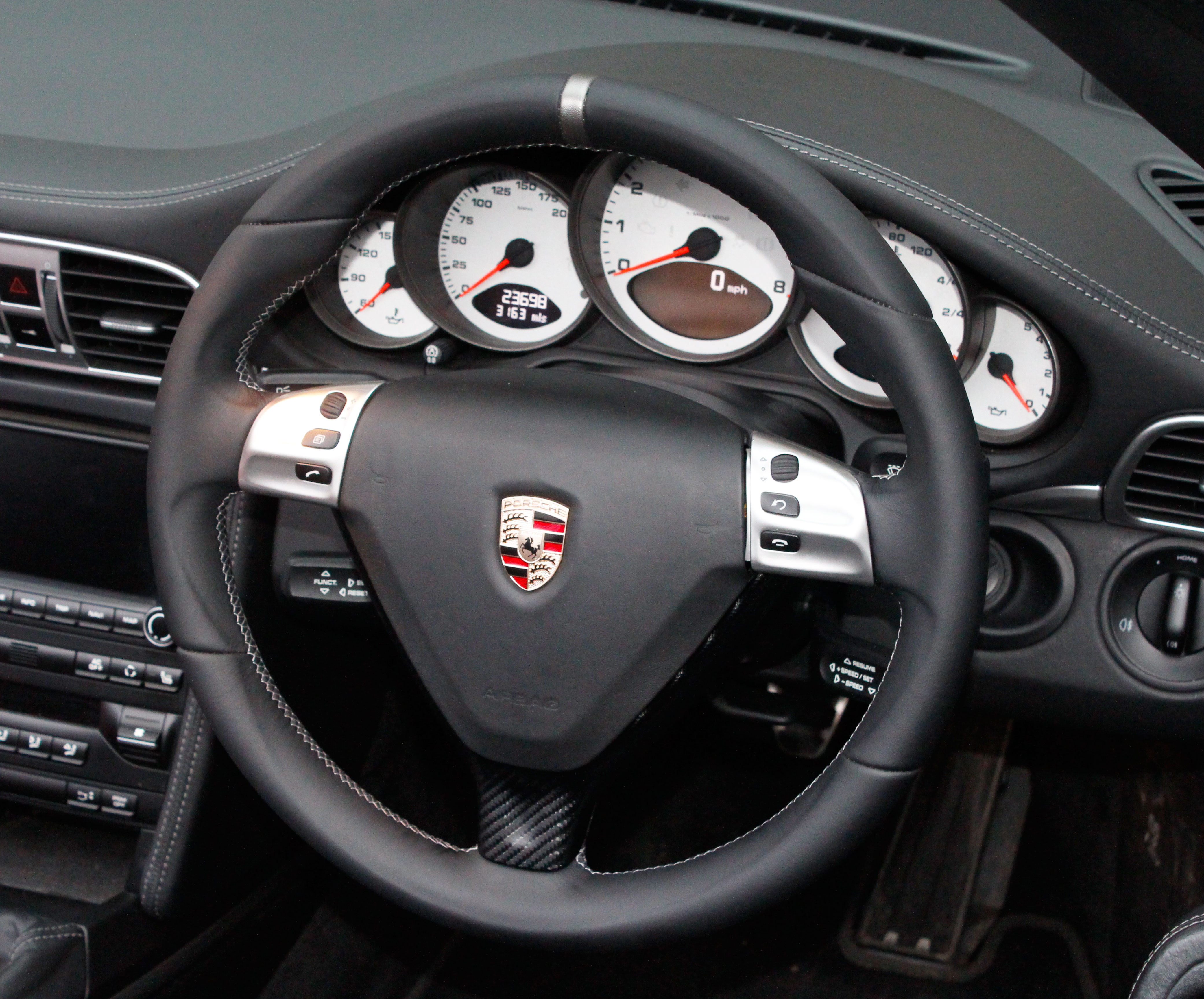 porsche 911 997 steering wheel re trimmed in black leather with silver stitvhing by designls ltd